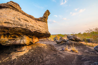 Rock formation on land against sky