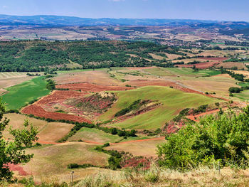 Aerial view of agricultural field against sky