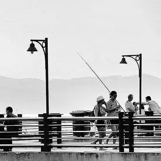 railing, men, clear sky, lifestyles, street light, leisure activity, built structure, full length, person, architecture, standing, steps, rear view, building exterior, copy space, walking, water