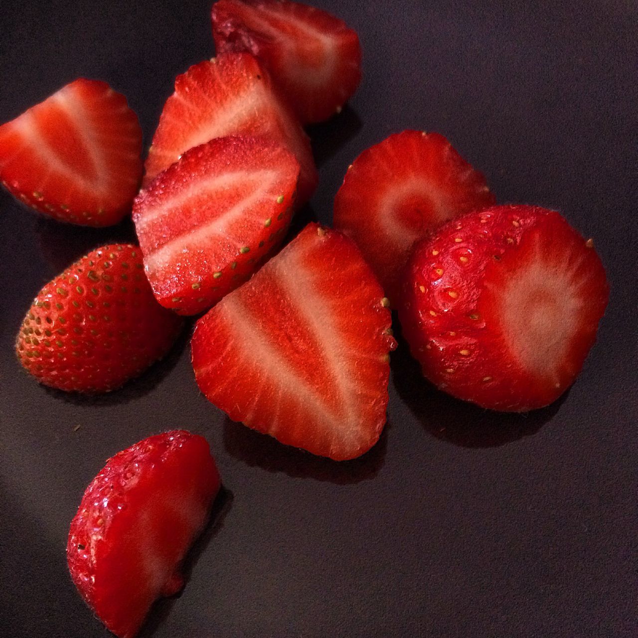 food and drink, food, red, freshness, healthy eating, still life, fruit, indoors, close-up, studio shot, table, juicy, organic, strawberry, high angle view, slice, no people, ripe, black background, raw food