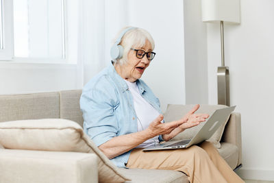 Doctor using laptop at home