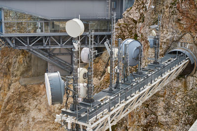 High angle view of machinery on road by building