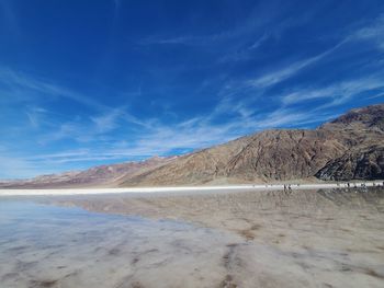 Scenic view of lake against blue sky