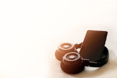 High angle view of camera on table against white background