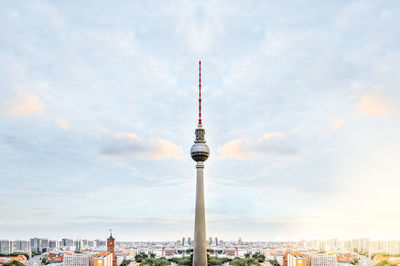 City skyline against cloudy sky