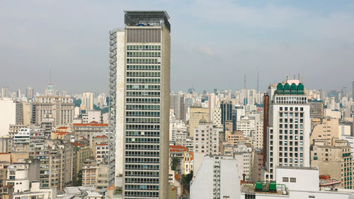 Modern buildings in city against sky