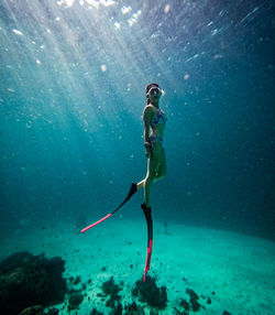 Woman swimming in sea