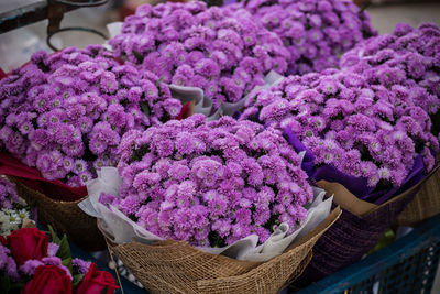 High angle view of purple flowers in basket at market