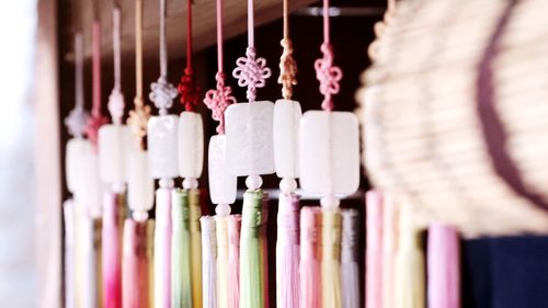 Close-up of multi colored decorations hanging in shop