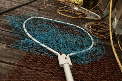 Close-up of fishing net in boat