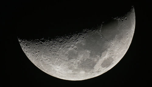 Low angle view of moon in sky at night