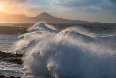 Scenic view of sea against sky during sunset