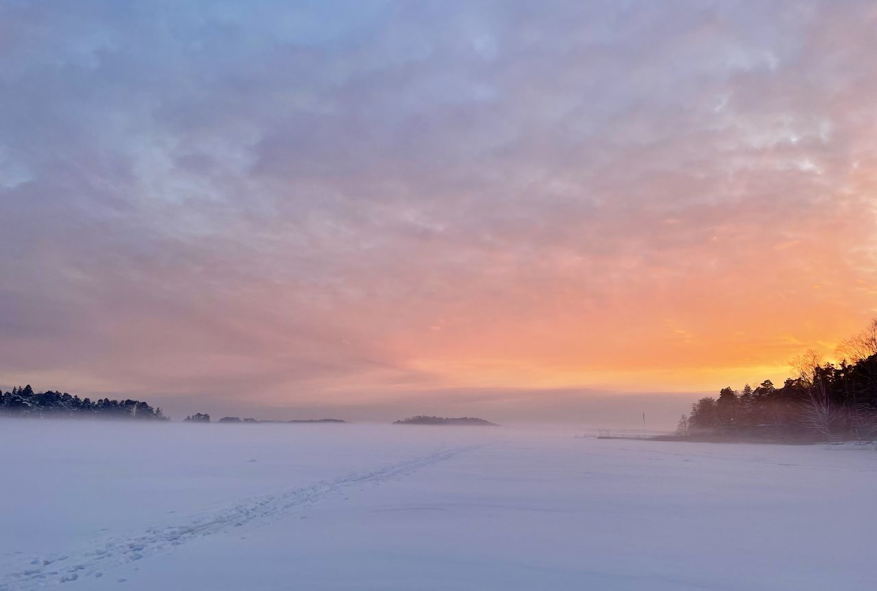 sky, sunset, scenics - nature, beauty in nature, environment, cloud, landscape, nature, tranquility, dawn, tranquil scene, water, cold temperature, winter, snow, land, tree, no people, dramatic sky, sun, plant, idyllic, horizon, sea, outdoors, twilight, blue, orange color, atmospheric mood, frozen, ice, non-urban scene, travel destinations, evening, reflection, travel, cloudscape, sunlight, rural scene, fog, copy space