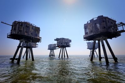 Lifeguard hut in sea against clear sky