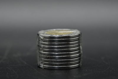 Close-up of coins on table
