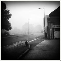 Man on road against sky