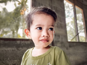 Portrait of cute boy looking away