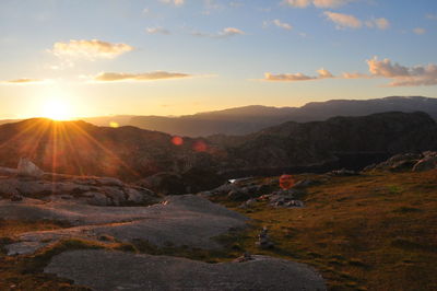Scenic view of landscape against sky during sunset