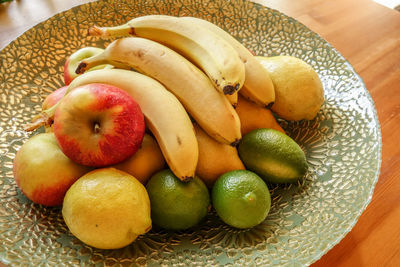 Close-up of fruits in basket on table