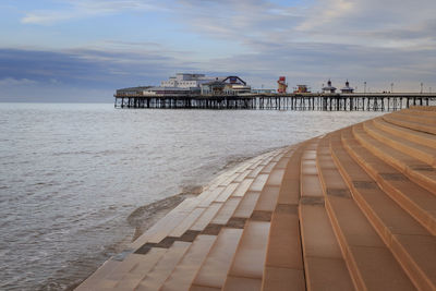 Pier over sea against sky