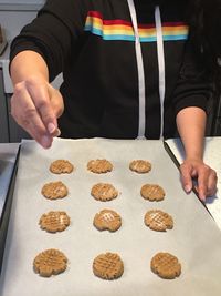 Midsection of man preparing food