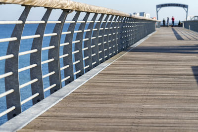 Surface level view of footpath leading towards footbridge