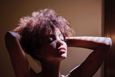 Close-up of young woman with eyes closed