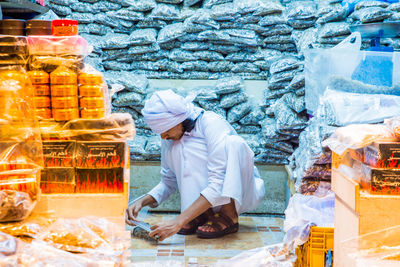 Man working at market stall