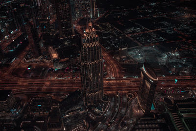 High angle view of city lit up at night