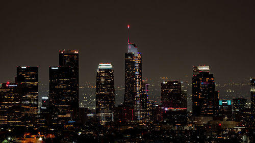 Illuminated buildings in city at night