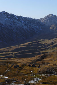 Scenic view of snowcapped mountains against clear sky