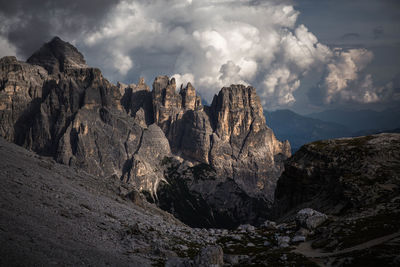 Scenic view of mountains against cloudy sky