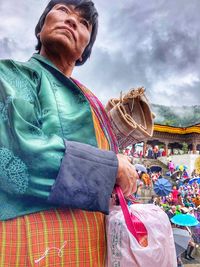 Full length of woman standing in market stall