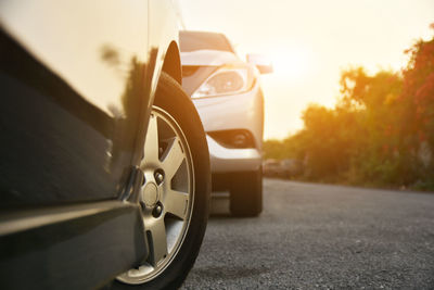 Close-up of cars on road