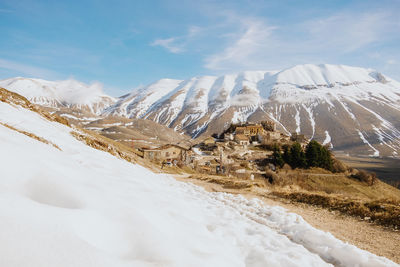 Scenic view of snowcapped mountains against sky