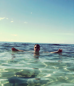 Portrait of man swimming in sea