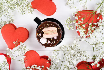 Directly above shot of red heart shape on table