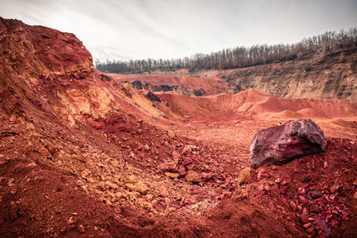 Rock formations on landscape against sky