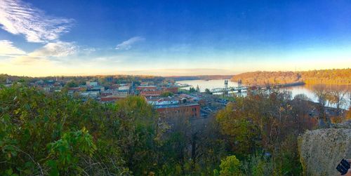 View of cityscape against cloudy sky