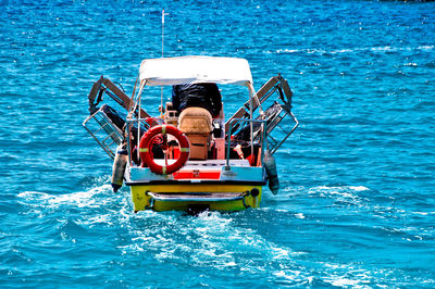 Man in boat on sea