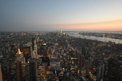 High angle view of city buildings during sunset