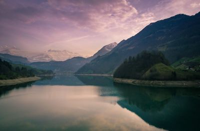 Scenic view of lake and mountains against sky