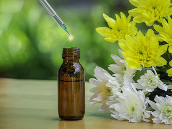 Close-up of medicines in jar on table