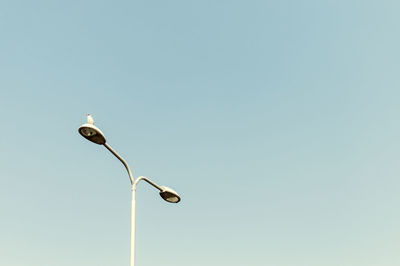 Low angle view of street lamp against clear sky