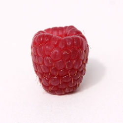 Close-up of strawberry over white background