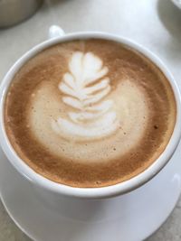 High angle view of cappuccino on table