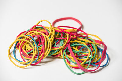 Close-up of multi colored pencils over white background