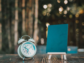 Close-up of clock on table