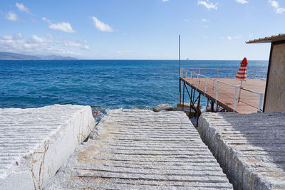 Pier over sea against sky