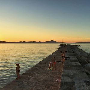 Scenic view of sea against clear sky during sunset